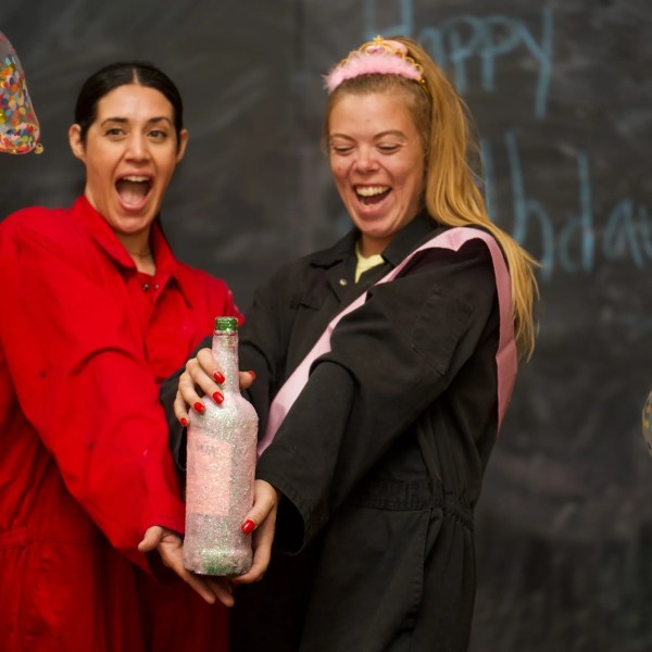 a man standing next to a woman