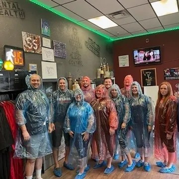 a group of people standing in a room